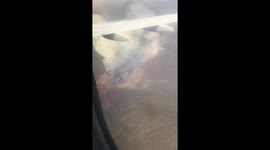 Plane flies through smoke from Canberra fires