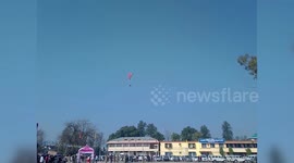 Paragliding pilot loses control and crashes into parking lot in northern India