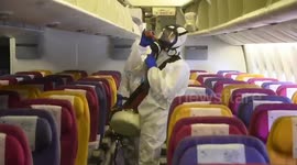 Thai airline staff disinfect plane to stop the spread of coronavirus