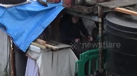 DEFYING THE COUNCIL, DESPERATE HOMELESS MAN MOVES ON TO A THAMES WRECK WHICH LOOKS LIKE JUNK. BUT IT'S BETTER THAN SLEEPING ROUGH.