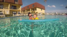 Toddler learning to swim