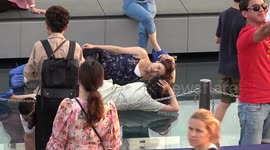 Tourists enjoy stunning view from 1,000ft high glass skywalk in Bangkok