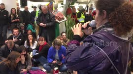 Protesters occupy the entrance of a shopping center