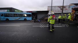 A single-decker school bus had a close shave when it crashed into a barber shop - with 20 kids on board