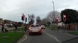 Car nearly hits school children