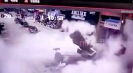 Manhole explosion sends four people flying into air after woman throws fireworks down it
