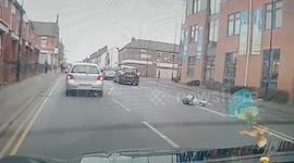 Moment car mounts curb and sends UK man flying into the air