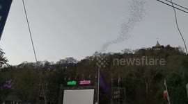 Stunning moment thousands of bats emerge from cave in Thailand
