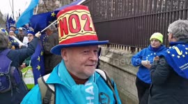 Man wears 'No to Brexit' hat on Brexit eve in Westminster