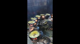 Three chefs use 36 pans to make crepes for thousands of visitors celebrating Lunar New Year in southern Vietnam