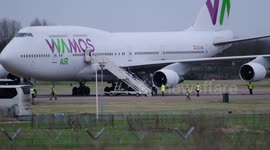 UK nationals land at RAF Brize Norton from Wuhan and begin disembarking
