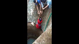 Brave woman saves stray dog from bottom of 30-foot-deep well in India