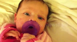 Funny baby reaction to parent making strange noise