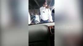 Police officer gets dragged 2km on car BONNET