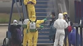 Indonesian nationals flying in from Wuhan sprayed with disinfectant as they disembark plane