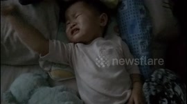 Toddler cries instantly after his pacifier is removed while he sleeping