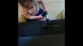 2 year old little girl Lacey hoovering the stairs