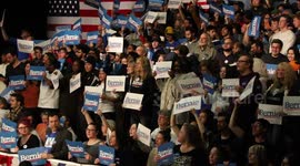 Iowa Caucus Night: Sanders supporters cheer and wave signs