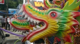Craftsmen in Indonesia make colourful dragon puppets out of recycled flip-flops and plastic goods