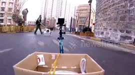 Chinese woman uses remote control car to buy steamed buns from shop amid coronavirus outbreak