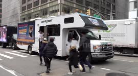 Orthodox Jews watch 70 'mitzvah tanks' roll through NYC to celebrate rabbi