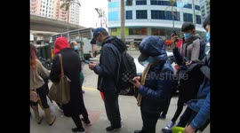 Hongkongers camp overnight and queue around the block in race to buy face masks