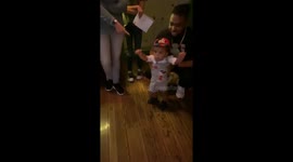 Toddler meets Mickey Mouse at Disneyland