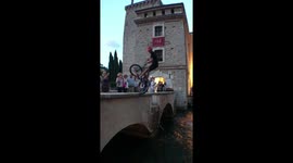 Synchronized flip stunts with bikes into the lake