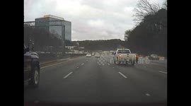 Dashcam footage shows moment tree crashes onto highway as storms rip through Atlanta
