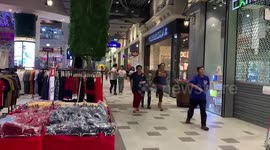 Shoppers flee as gunman kills 12 and takes hostages inside mall in Thailand