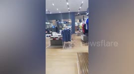 Shop worker hides after gunman opens fire and takes hostages in Thailand