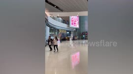 Thai shoppers run for their lives after gunman opens fire killing 12