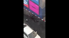 Man lies injured on ground after shopping mall shooting in Thailand