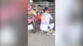 EXTREMELY GRAPHIC VIDEO: Injured pedestrians treated in the street during mass shooting in Thailand