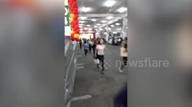 Moment families dive for cover as gunman enters Thai shopping mall