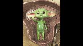 such a cutie Baby Yoda figurine from mandolorian tv series