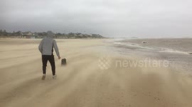 High winds from Storm Ciara whip across Suffolk beach in UK