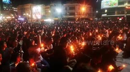 Thousands of grieving Thais hold candlelight vigil for mass shooting victims