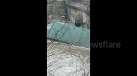 West Yorkshire bridge closed as shipping container carried by Storm Ciara flooding becomes lodged under it
