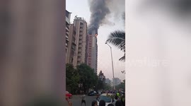 Fire breaks out in top floors of Mumbai apartment complex after gas cylinder explosion