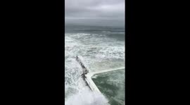 Waves crash into Bondi Beach's famous Iceberg Club as storm hits Sydney