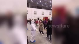 Heartwarming moment nurses in hazmat suits dance with quarantined patients in China's Wuhan