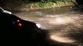Storm surge at high tide on road leading to Benone Beach, UK