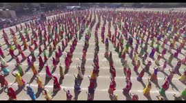 Drone footage_Thousands of women valorously sway to the royal sword dance making their place into Guinness book of records in the western Indian state of Gujarat