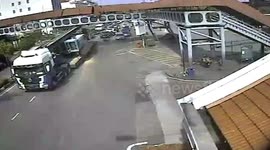 Truck driver misjudges height of load and hits footbridge in Malaysia