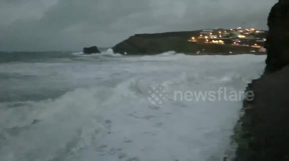 Giant waves sweep past couples garden gate during storm Ciara