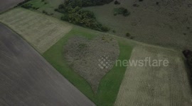 Drone camera films giant love heart in English countryside