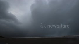 Brutal Storm Clouds Dropping Hailstones Over Ocean - Winter Storms