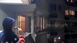 Chinese singer holds concert on balcony to entertain neighbours during coronavirus lockdown