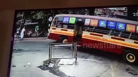 Biker and pillion rider miraculously survive bus accident, caught on CCTV in southern India